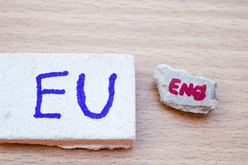 Brexit UK EU referendum concept with word UN and Eng on stone wall