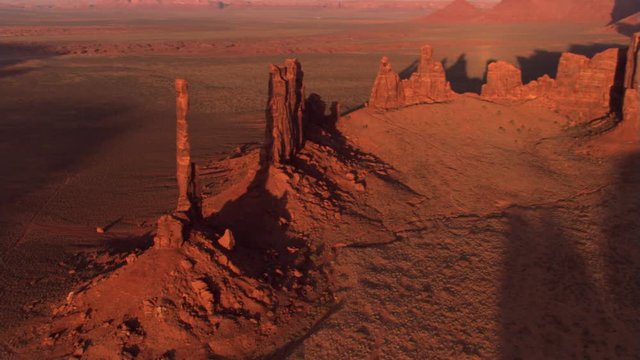 Orbiting Totem Pole Rock in Monument Valley, with lens flares