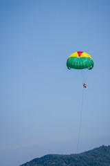 The women playing parachute on blue sky