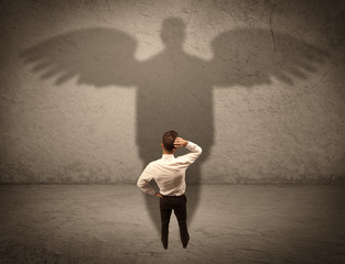 Honest salesman with angel shadow concept