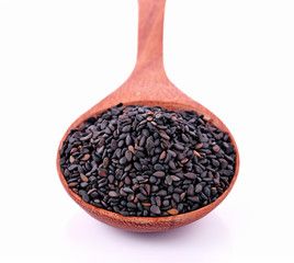 Sesame black in spoon on white background