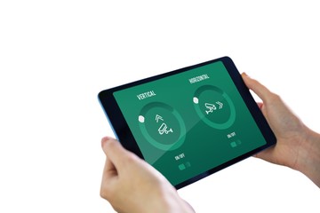 Composite image of hands holding tablet