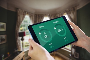 Composite image of hands holding tablet