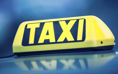 Taxi car waiting passengers in town.Taxi light on the cab of the car ready to transport the...