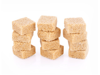Natural sugar cubes on white background