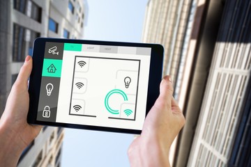 Composite image of finger pointing to tablet