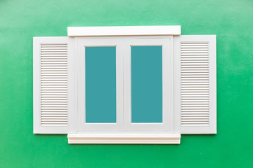 White window classic vintage on the color green wall background