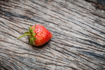 Small white filled with succulent juicy fresh ripe red strawberr