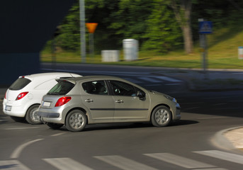 Fototapeta na wymiar Two cars in motion