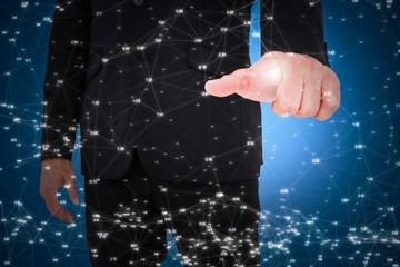 Composite image of businessman pointing with finger