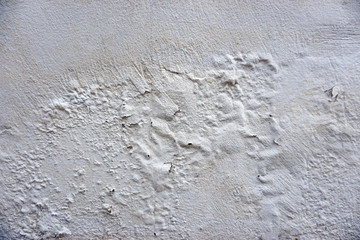 Old cracked paint on the concrete wall