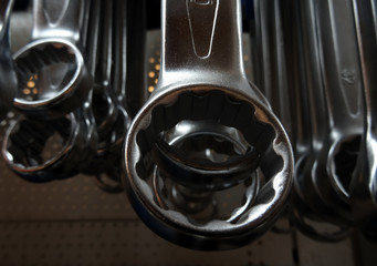 Variety size of wrenches on the shelf at hardware shop 