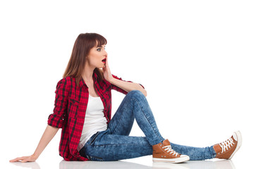 Surprised Girl Sitting On Floor