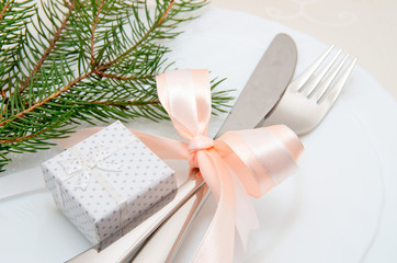 Christmas table place setting with christmas decorations