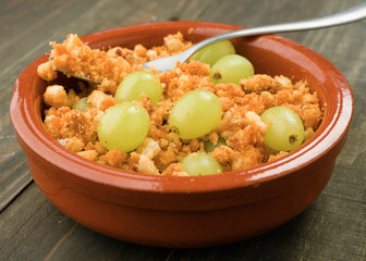 ration shepherd crumbs with fresh grapes, typical Spanish