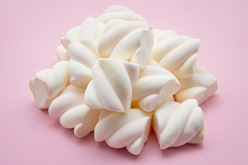 Fototapeta na wymiar heap of marshmallow on pink