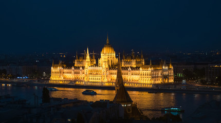 Fototapeta na wymiar illuminated building of the National Hungarian Parliament at night aerial photo