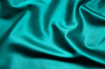 Green satin fabric as background