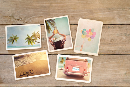 Photo album remembrance and nostalgia of journey honeymoon trip in summer on wood table. beach holiday relaxation. instant photo of vintage camera - vintage and retro styles