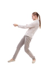 back view of standing girl pulling a rope from the top or cling