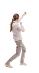 back view of standing girl pulling a rope from the top or cling