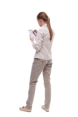 back view of  stands woman takes notes in a notebook. girl  watc