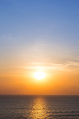 Naklejka na ściany i meble Beautiful morning sun light a long the sea background.