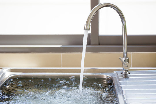 Flowing Water Into Sink.