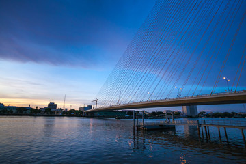 Rama 8 Bridge at sunrise in Bangkok and Chopraya river, Thailand