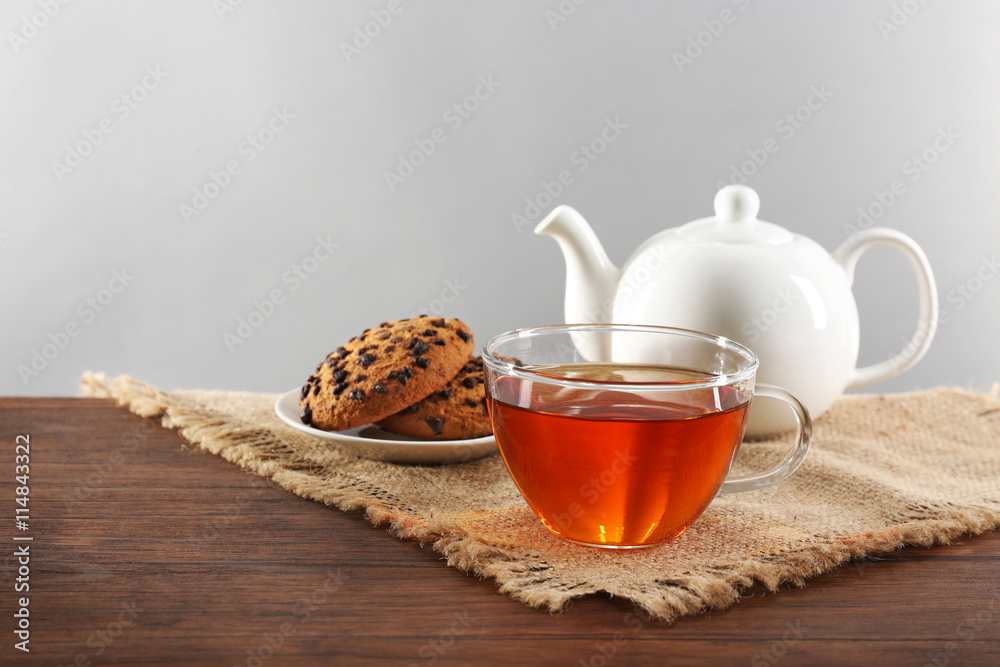 Wall mural White ceramic tea set on wooden table