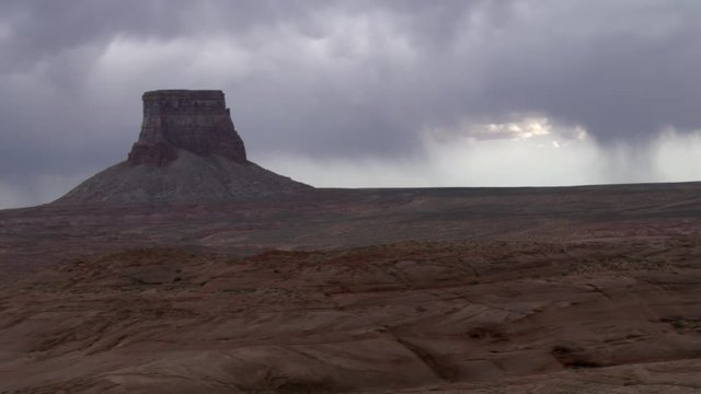 Flying past Arizona's Tower Butte under stormy skies