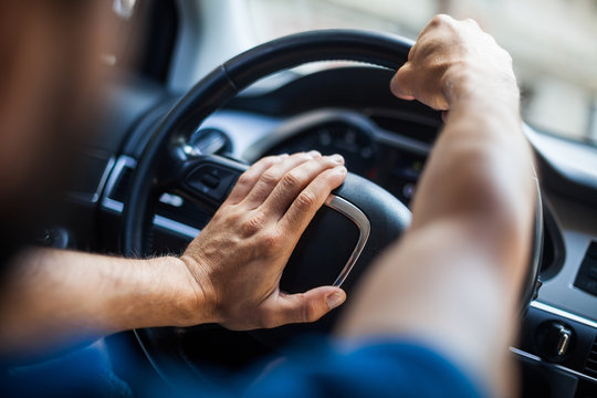Hands on steering wheel, honking