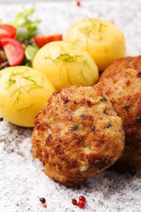 Fresh, homemade meatballs, served with tomato salad and new pota