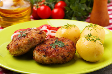 Fresh, homemade meatballs, served with tomato salad and new pota