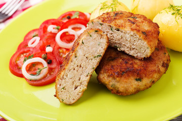 Fresh, homemade meatballs, served with tomato salad and new pota