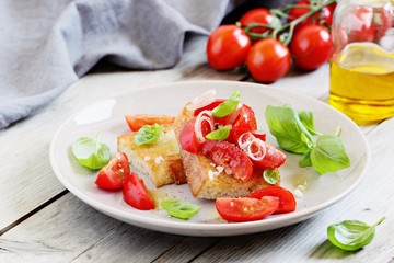Bruschetta with tomatoes,shallot and basil. Selective focus