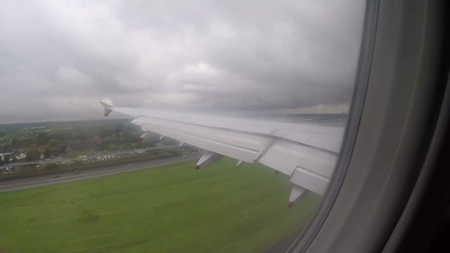 Color footage of an airplane during landing. 