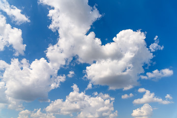 Naklejka na ściany i meble White Cumulus Clouds On Blue Sky