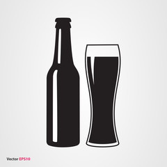 Bottle of dark craft beer with glass