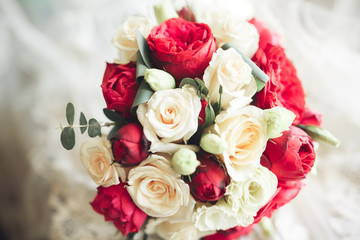 Bouquet of beautiful flowers and greenery is on the green grass