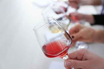 Experts tasting new sorts of wine at the table © Africa Studio