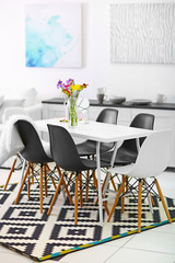 Beautiful comfortable modern interior with table and chairs