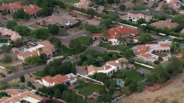 Flight over wealthy Scottsdale residential area bordering a golf course. Shot in 2007.