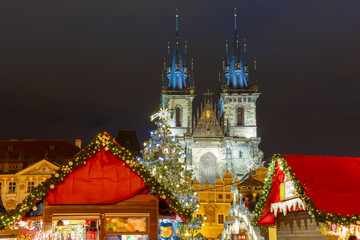 Obraz premium Old Town Square with Christmas market, tree and fairy tale Church of our Lady Tyn in the magical city of Prague at night, Czech Republic