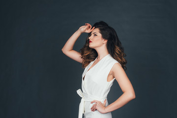 beautiful girl on a black background in the studio 