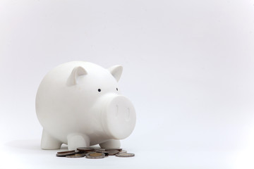 Dirty piggy bank and coin from baby on the white background, piggy bank isolation, saving