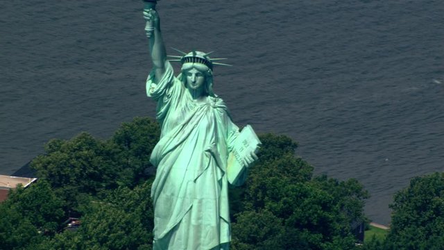 Close flight past Statue of Liberty to zoom-out. Shot in 2003.