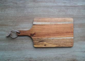 Cutting board on wooden background