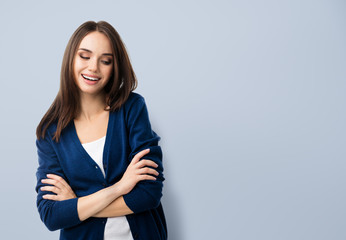 smiling young woman with crossed arms