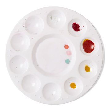Artists dirty paint palette isolated on a white background